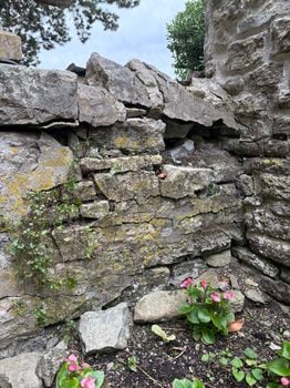Photo shows the west gate return as viewed from inside the churchyard