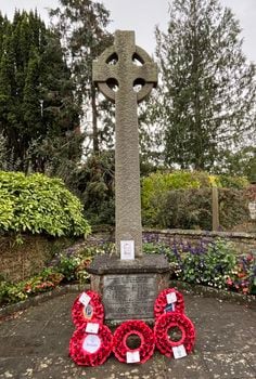 Image of the Saltford War Memorial with wreathes, taken on on Remembrance Sunday 2025